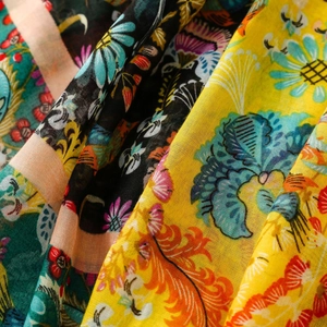Macro detail of floral cotton linen shawl with vibrant ethnic patterns and woven texture