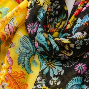 Macro detail of breathable cotton-linen shawl with vibrant bohemian floral print