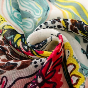 Macro view of floral and leopard print fabric with soft drape and delicate texture