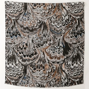 Detail of pashmina scarf with marble pattern texture and delicate fringed edges