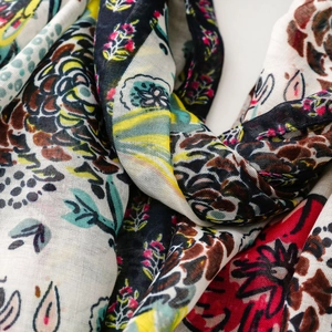 Close-up of bohemian floral print scarf showing soft cotton-linen fabric texture