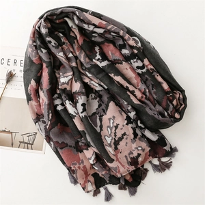 Detailed view of the soft abstract art pattern scarf with elegant handmade grey fringe