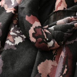 Detailed macro view of soft abstract floral print fabric with natural fiber texture