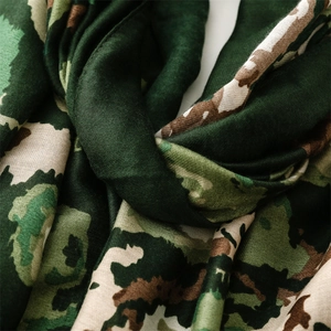 Detail showing the jungle camouflage print and breathable soft cotton fabric texture