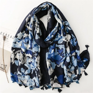 Detail of soft leopard pattern shawl with ink painting style and handmade tassels