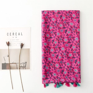 Ethnic style dark pink floral scarf with tassels for sun protection and travel styling
