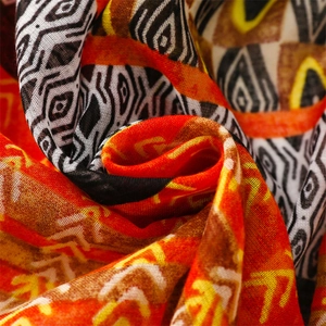 Macro shot of ethnic geometric pattern fabric with woven texture and vivid colors