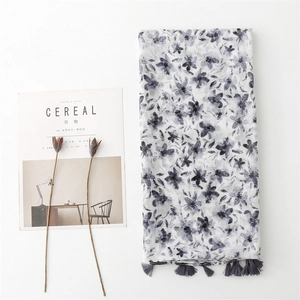 Floral print long scarf with tassels, styled with Cereal magazine on white backdrop