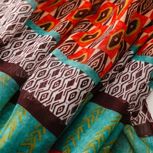 Macro shot of ethnic geometric patterns on lightweight breathable shawl fabric