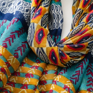 Macro shot of ethnic pattern scarf featuring geometric prints and lightweight texture