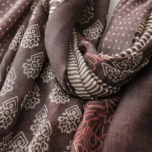 Macro view of woven cotton linen fabric with geometric patterns and fringe detail