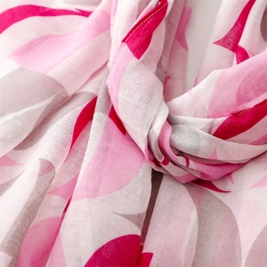 Detailed texture of lightweight pink and grey geometric floral print scarf shawl