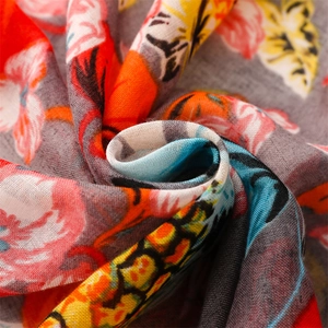 Detailed macro view of tropical fruit and floral print fabric for summer lightweight scarves