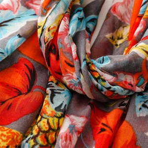Macro detail of tropical fruit print scarf showing breathable cotton linen fabric texture