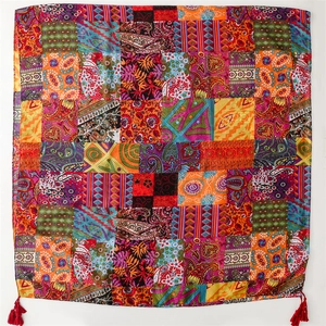Bohemian patchwork scarf with paisley patterns, ethnic floral prints, and red tassels