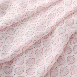 Close-up of lightweight strawberry pattern fabric showing thin texture and soft drape