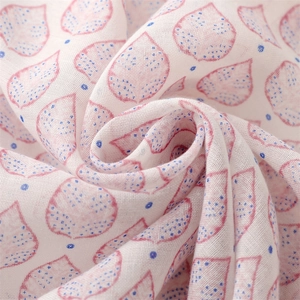 Close-up of heart-shaped leaf print on breathable cotton scarf fabric texture