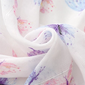Detailed macro shot of semi-transparent butterfly print cotton linen scarf fabric texture