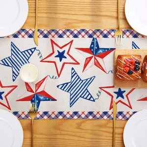 Independence Day table runner with red blue stars and plaid pattern on wooden table