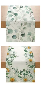 Detailed texture of polyester table runner with daisy and eucalyptus floral print