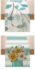 Close-up of polyester table runner with watercolor leaf and sunflower daisy patterns