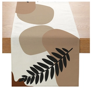Close-up of Morandi polyester table runner with abstract circles and feather leaf patterns