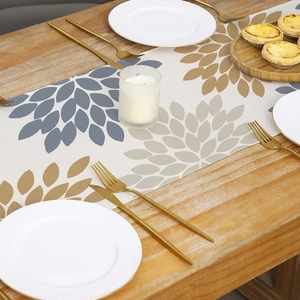 Morandi style polyester table runner with abstract floral pattern on a wooden dining table