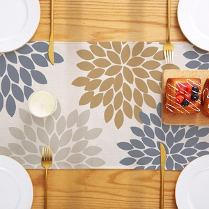 Morandi style polyester table runner with abstract floral print on a wood dining table