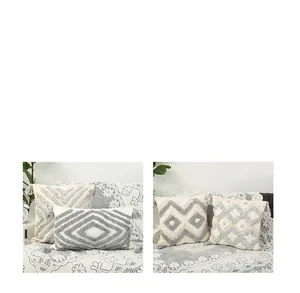 Detail of bohemian tufted geometric pattern and tassel fringe on a cotton pillow cover