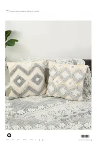 Detailed view of tufted geometric patterns and decorative tassels on bohemian pillow covers