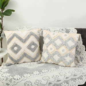 Bohemian tufted throw pillow covers with geometric wave and diamond patterns and tassels