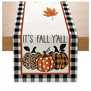Detail of fall table runner featuring artistic pumpkins and It's Fall Y'all text