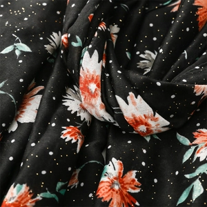 Detail of floral printed scarf with white dots and gold foil sparkle texture