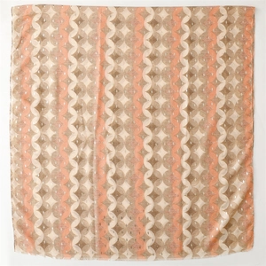 Detail of cotton-linen feel scarf showing geometric patterns and raw fringe edges