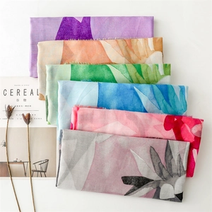 Detail of colorful watercolor floral cotton linen scarves with natural frayed edges