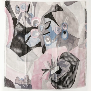 Close-up of lightweight cotton-linen scarf with geometric pattern and raw fringe edges