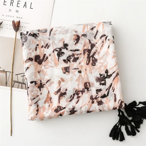 Artistic watercolor scarf with elegant fringe and cotton-linen texture on white background