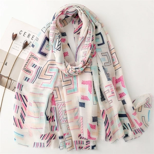 Lightweight cotton-linen blend scarf with geometric patterns and fringe edges