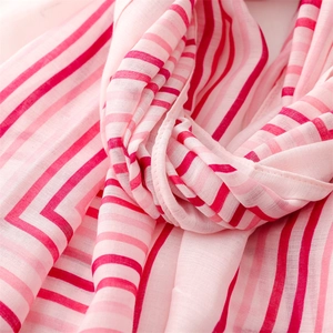 Detailed close-up of pink and white striped lightweight linen-touch fabric with soft texture