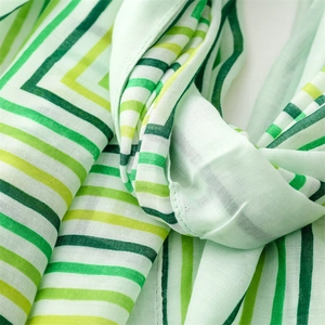 Detail shot of lightweight cotton linen scarf showing green and white striped texture