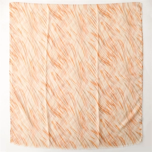 Detail of artistic orange and brown abstract stripe pattern on soft linen-feel scarf