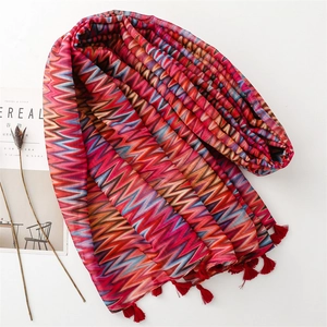 Colorful wave pattern shawl with red tassels for sun protection and summer travel