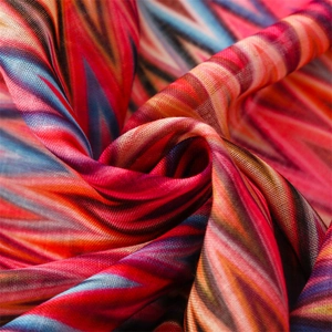 Macro shot of colorful wave pattern on lightweight scarf fabric with soft drape