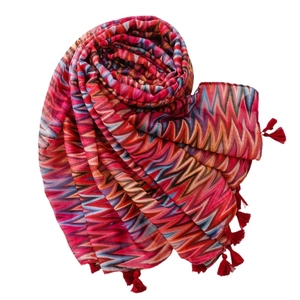 Colorful geometric wave pattern scarf with red tassels made of lightweight fabric