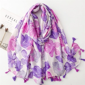 Detail of floral linen-feel scarf with purple tassels and artistic flower print