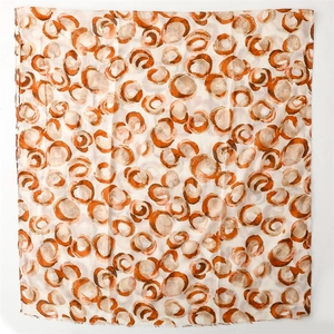 Detail view of cotton-linen feel scarf with gold donut print and frayed edges
