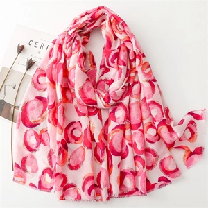 Light pink cotton linen scarf with gold donut print and frayed edges for women
