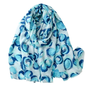 Light blue cotton linen scarf with abstract gold donut pattern and frayed edges