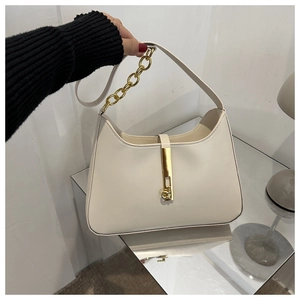 Detail of cream white leather hobo bag with gold metal chain and iconic lock closure