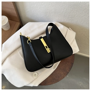 Detailed close-up of a black PU leather underarm bag with a sleek gold metal buckle